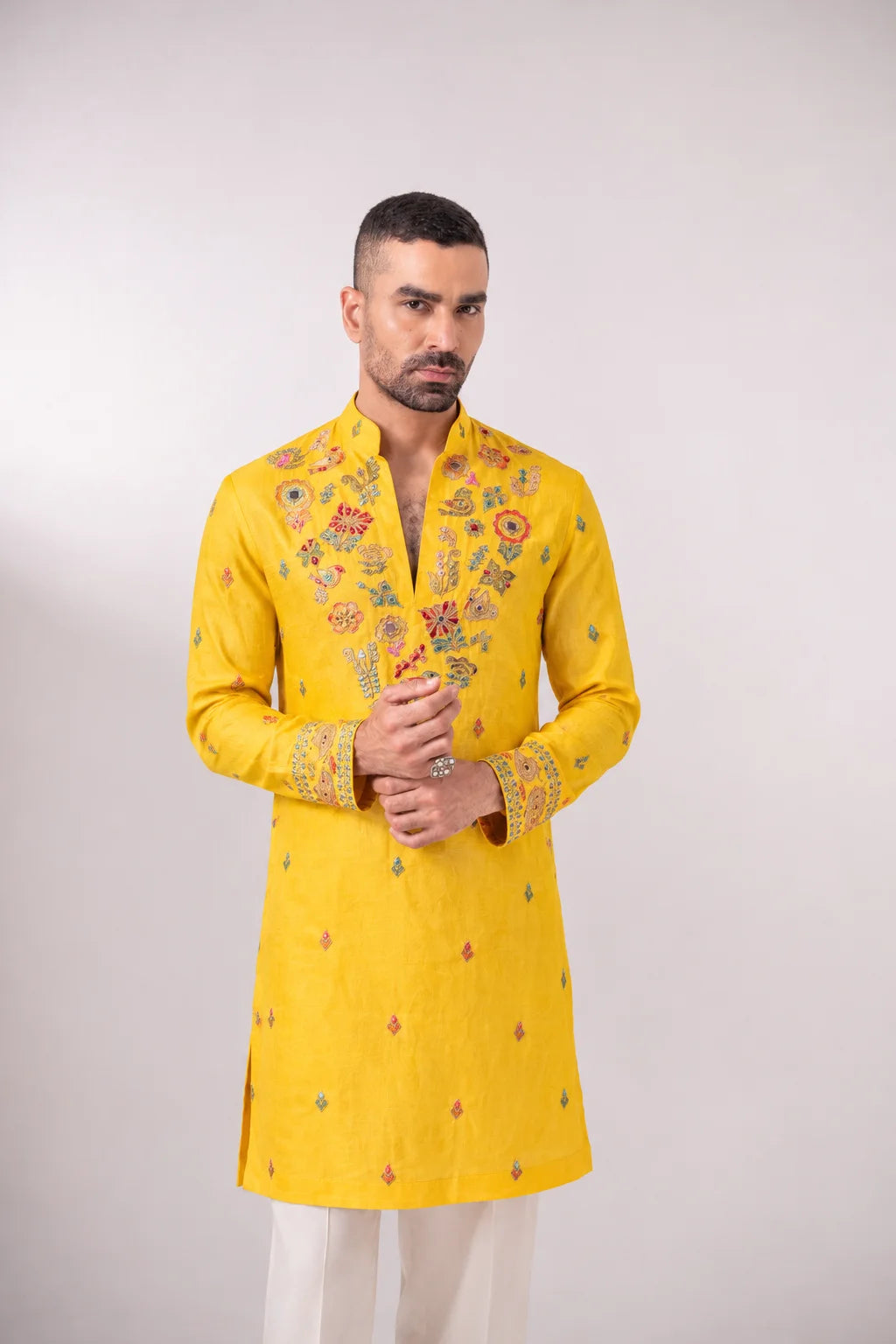 Rangrez yellow linen satin kurta for men with multicoloured embroidered neckline by Char Chaand